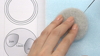 Tear off a piece of sheet felt one size bigger than pattern J. Form the shape by poking with a needle.
