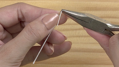 Use pliers to bend the wire at the marks at each end.