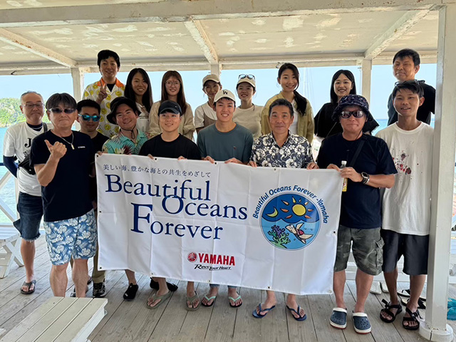 Group photo taken during participation as a supporting company of the coral reef conservation project “Team Tyura Sango.”