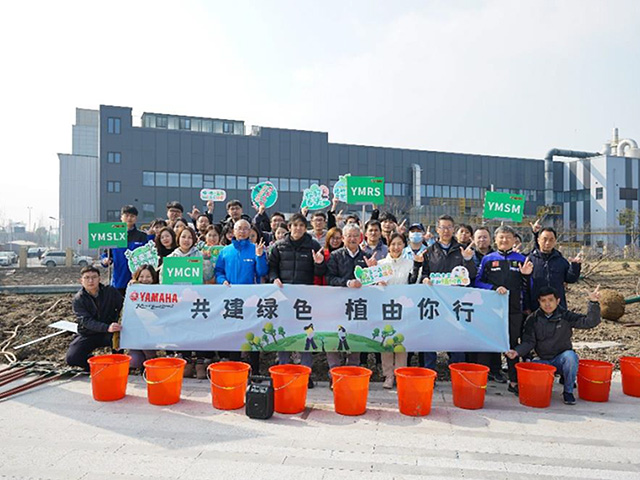 Group photo taken during tree-planting activities held in preparation for the annual tree-planting festival at YMCN
