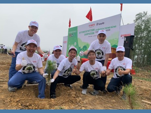 Employees engaged in tree-planting activities to raise environmental awareness at YPMV.