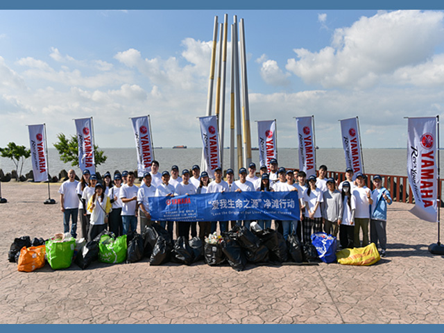 Group photo taken during a beach cleanup activity conducted in collaboration with a local marine conservation organization.