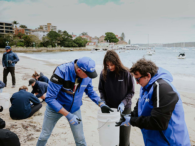 Collecting garbage at the beach clean-up campaign held in Sydney