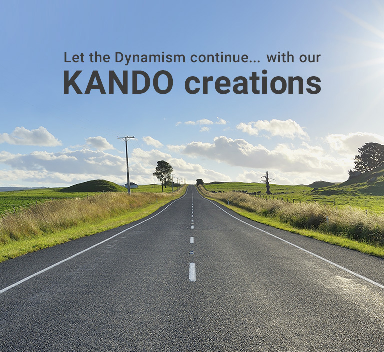 Let the Dynamism continue... with our KANDO creations - A narrow road running through a green meadow, extending far into the distance