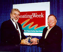 YMUS Marine Group President Phil Dyskow (right) receives the award