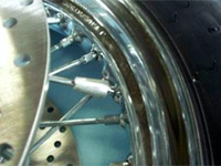 Example of a wheel balance weight attached on spoke wheel