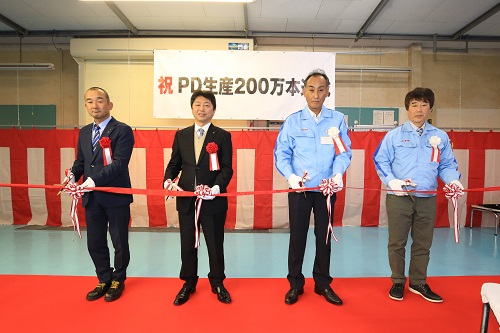 ceremony to mark the two-million-unit milestone (right)