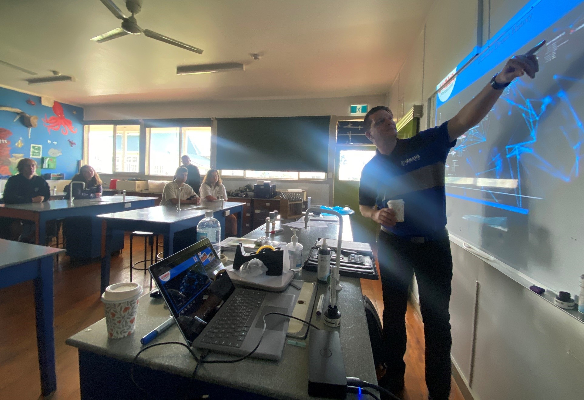 Holding a class at a Norfolk Island school on providing environmental conservation solutions with unmanned helicopters