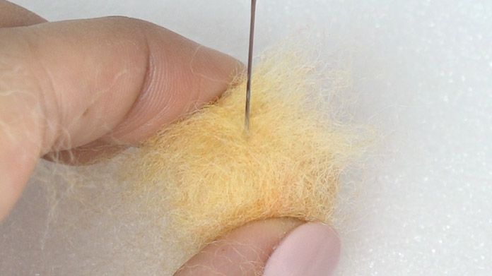 Poke the surface with the finishing needle to create a nice finish.
