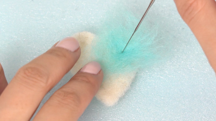 Poke the finishing needle lightly and in a shallow manner on the surface.