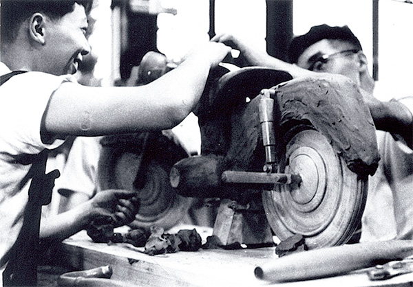 The design team using clay and wood to create a design mock-up