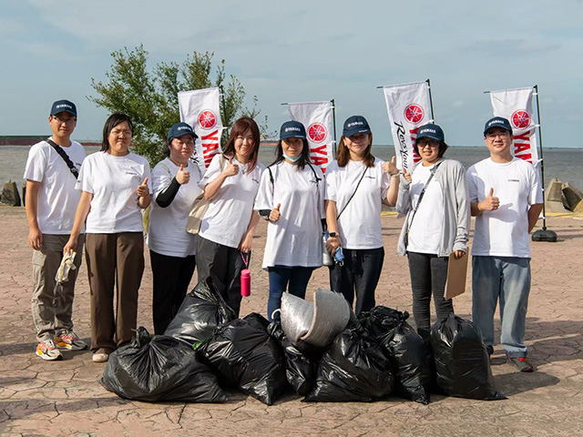 Group photo taken during the beach cleanup activities conducted by YMCN